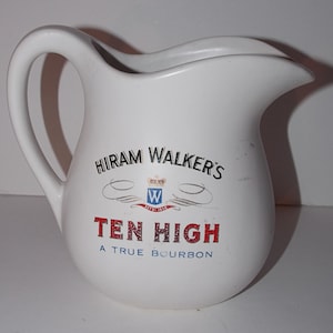 May include: White ceramic pitcher with a black and white logo that reads "Hiram Walker's Ten High A True Bourbon" with a crest featuring a "W" and the text "Est'd 1858".