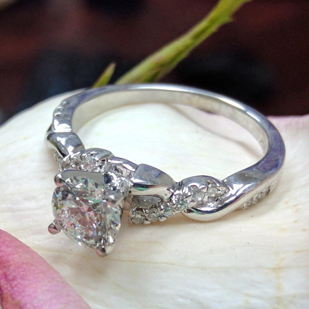Twisted pave halo engagement ring sale