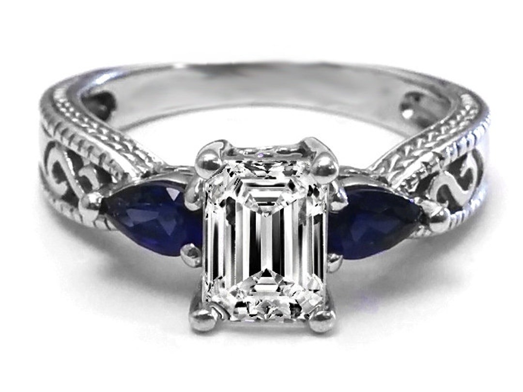 Emerald cut diamond with online sapphire side stones
