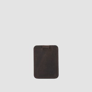 Elegant dark brown leather card wallet with built-in pull-tab feature for smooth card retrieval
