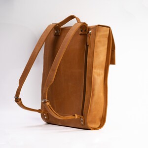 premium orange leather city minimalist backpack with a compartment for notepad