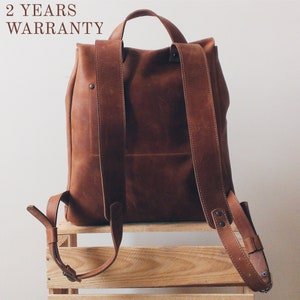 stylish vintage backpack with two font pockets hand made crafted in cognac brown color designer