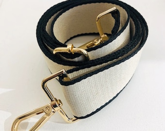 Adjustable beige and black shoulder strap for bag