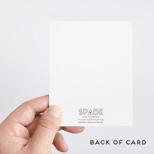 May include: The back of a white card with black text that reads "SPADE STATIONERY www.spadestationery.com DESIGNED + PRINTED IN THE USA" and the words "BACK OF CARD" in black text.