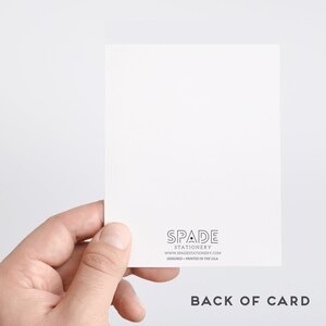 May include: The back of a white card with black text that reads "SPADE STATIONERY www.spadestationery.com DESIGNED + PRINTED IN THE USA" and the words "BACK OF CARD" in black text.