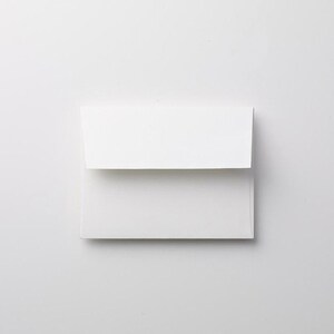 May include: A white envelope with a flap.