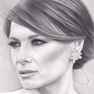 May include: A graphite pencil drawing of a person with hair styled in a side-swept updo. The subject is shown in a three-quarter profile view, wearing a large, multi-petaled floral-shaped earring on the visible ear, rendered in shades of gray.