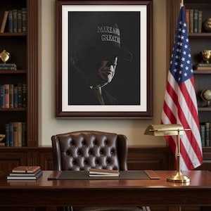 May include: A framed portrait of a person wearing a dark cap with the text MAKE AMERICA GREAT AGAIN, displayed in a study with a wooden desk, a leather chair, a brass lamp, bookshelves, and an American flag standing in the corner.