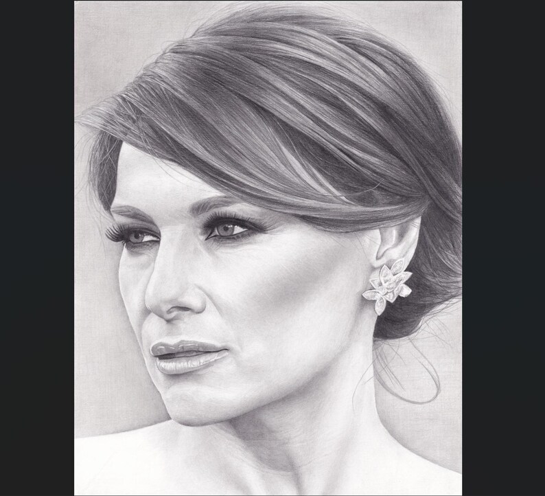 May include: A black and white graphite pencil drawing of a person with side-swept hair, wearing a detailed floral-shaped earring. The portrait captures the facial features, including defined eyes, eyelashes, and lips, rendered with shading.
