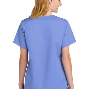 May include: A light blue scrub top with short sleeves and a V-neck. The top is made of a soft, comfortable fabric and is perfect for healthcare professionals.