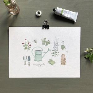 May include: A watercolor illustration of gardening tools and plants. The illustration includes a watering can, gardening gloves, a bee, a book, a pair of scissors, a ball of twine, a strawberry plant, and a stack of plant pots. The text "The Cottage Garden" is written at the bottom of the illustration.