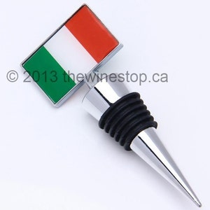 May include: A silver bottle stopper with a black rubber seal and a green, white and red Italian flag on top.