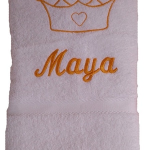 Towel embroidered with name and crown motif