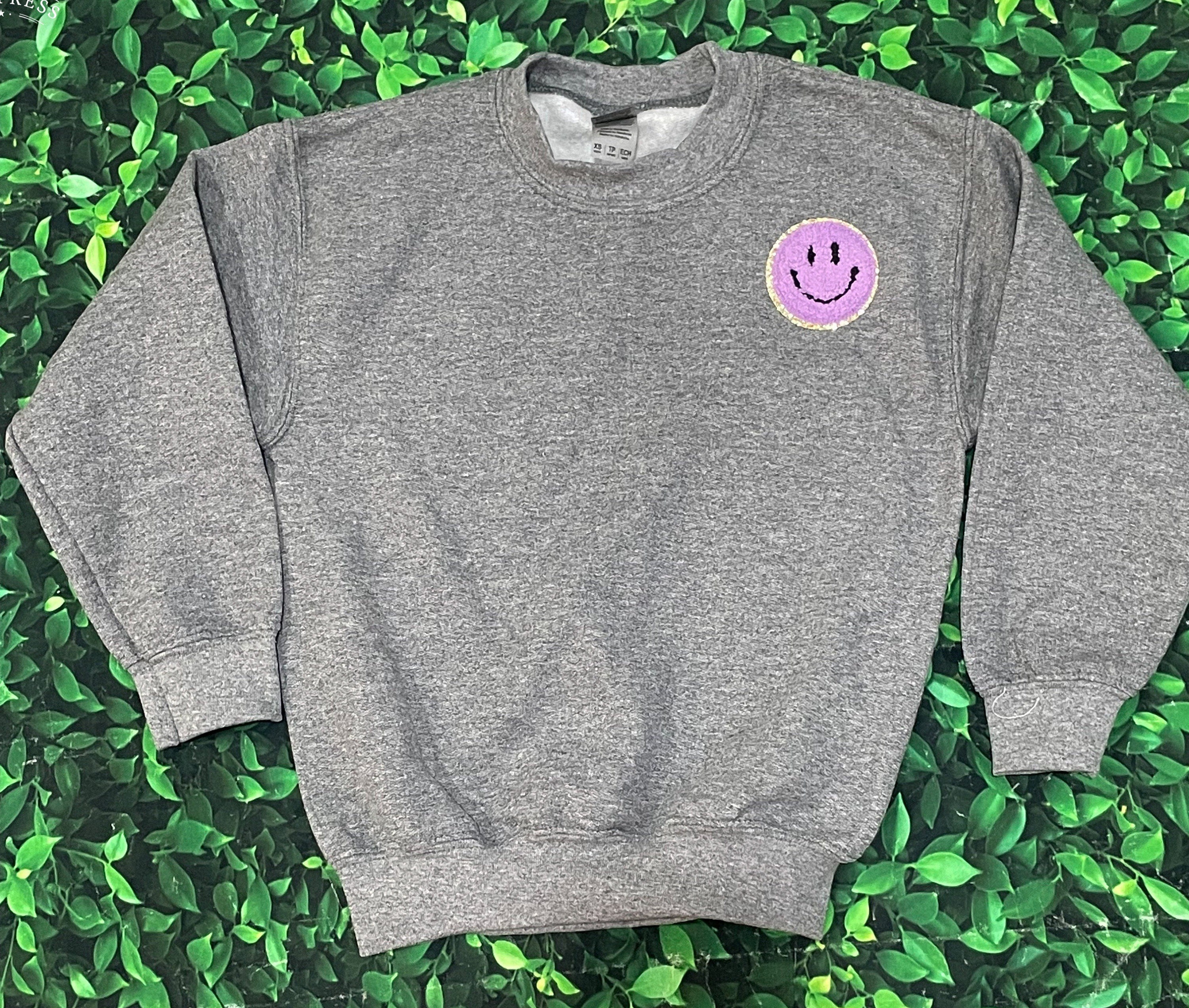 smiley face patch sweatshirt