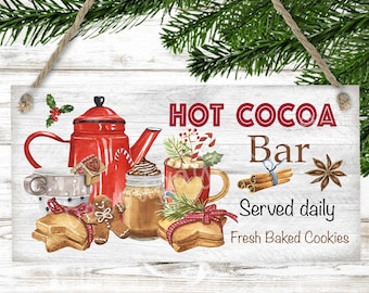 May include: Wooden sign with a watercolor illustration of a red teapot, mugs, cookies, and a jar of hot cocoa. The sign reads "HOT COCOA Bar" with "Served daily" and "Fresh Baked Cookies" below.