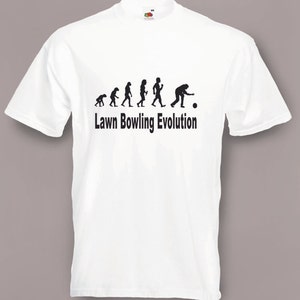 May include: White t-shirt with a black silhouette of the evolution of humans ending with a person bowling. The text "Lawn Bowling Evolution" is printed below the image.