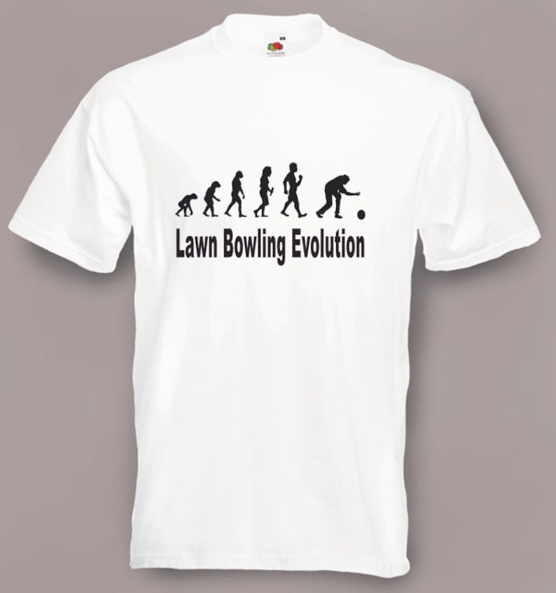 May include: White t-shirt with a black silhouette of the evolution of humans ending with a person bowling. The text "Lawn Bowling Evolution" is printed below the image.