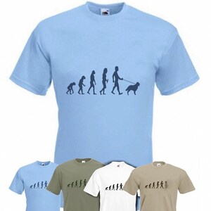 May include: A set of four t-shirts featuring a graphic of the evolution of humans, ending with a person walking a dog. The shirts are in light blue, green, white, and beige.