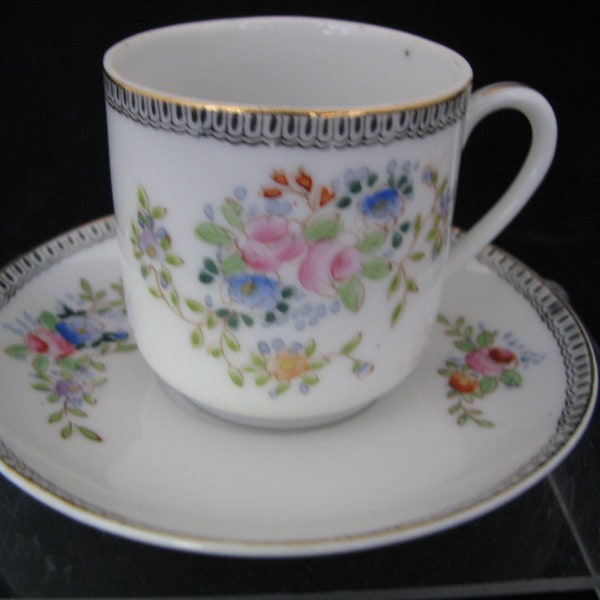 Occupied Japan Demitasse Teacup & saucer Excellent condition saucer 4 1/2" wide Floral with blue and gold border