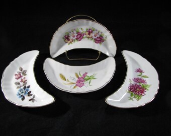 Set of 4 Bone / Crescent salad dishes floral design gold trim vintage 6 1/2" X 3" excellent condition.