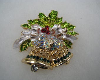 Holiday bells Brooch Rhinestones with gold tone background Just gorgeous and cute 1 1/2" X 2" Comes with cotton lined box for gift giving.
