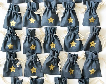 Advent calendar bags to fill yourself in pink or dark blue with gold stars and numbers