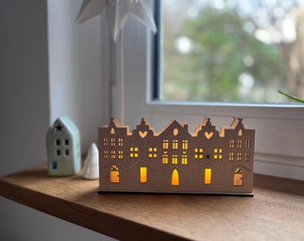Row of houses backlit, made of wood