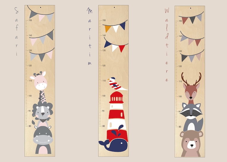 May include: Three wooden growth charts with different themes: Safari, Maritime, and Woodland. Each chart features a colorful animal illustration and a measuring scale in inches. The Safari chart has a giraffe, lion, and hippopotamus. The Maritime chart has a lighthouse, a seagull, and a whale. The Woodland chart has a deer, a raccoon, and a bear.