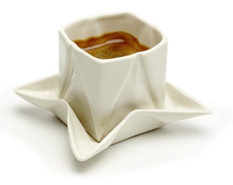 Origami espresso cup made of porcelain including saucer, with folds and kinks like folded paper