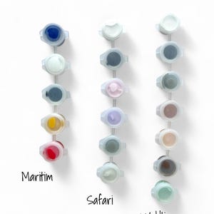 May include: A set of paint pots with different colors, labeled "Farben", "Maritim", "Safari", and "Waldtiere".