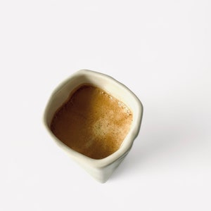 Origami espresso cup made of porcelain including saucer, with folds and kinks like folded paper image 4