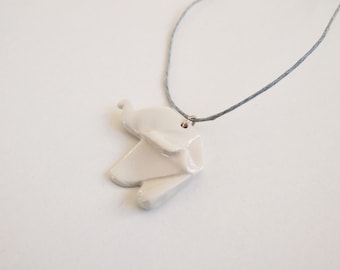 Necklace with origami pendant of porcelain