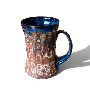 Handcrafted Agateware Stoneware Travel Mug: Fluted Pottery Coffee Cup with Blue Accents