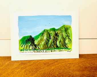 May include: A painting of a green mountain range with a blue sky and a few birds flying overhead. The painting is signed "A.M.100" in the bottom right corner and has the text "CERRO EL AULA, PARQUE NACIONAL" in the bottom left corner.