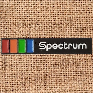 The Spectrum Arena Enamel Lapel Pin