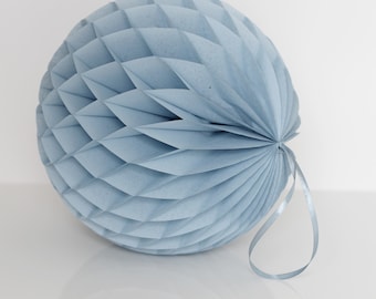May include: A light blue honeycomb paper ball with a matching ribbon.