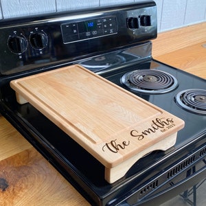 Half Size Maple cover sitting on a range with an engraving on the lower half of it.