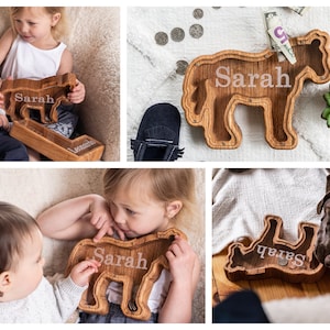 Wooden Horse Shaped Piggy Banks with Personalized Engraving on the Clear Front With White Background and Children Holding Banks
Made With USA Red Oak Wood, This wood Gives The Bank A Natural Red/ Brown Look