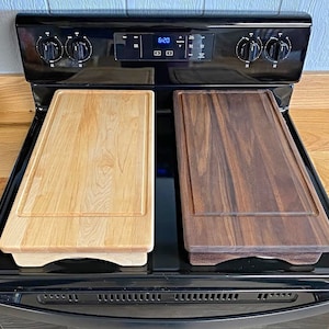 Maple and Walnut Half stove top covers sitting on range with no engravings