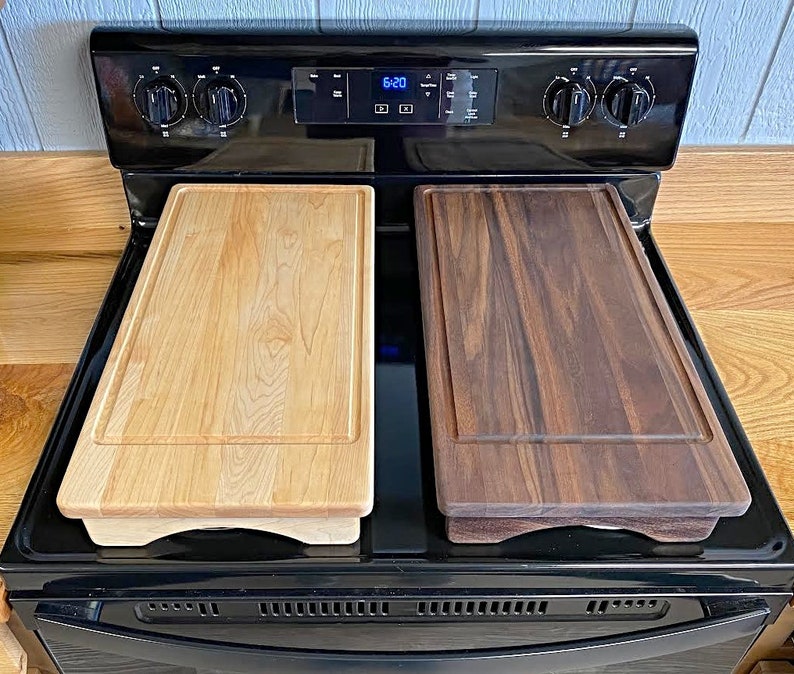 Maple and Walnut Half stove top covers sitting on range with no engravings