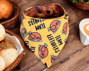 May include: Yellow bandana with a Thanksgiving theme. It features a turkey illustration and the text "Team Leftovers".