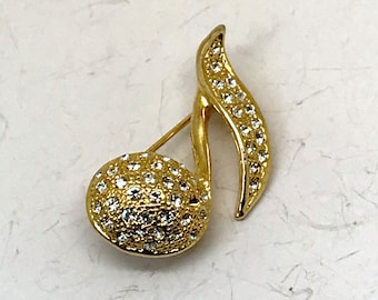 Vintage figural guldfärgad brosch med musiknoter och klar strass