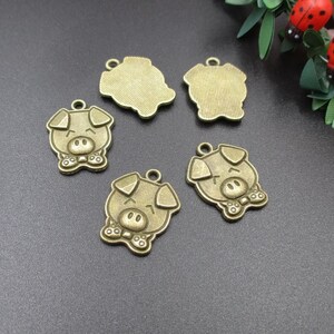 10 dijes de cerdo de bronce de 20 x 16 mm - p2103
