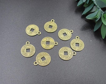 May include: Eight antique gold-toned Chinese coin charms with a square hole in the center and intricate designs. Each charm has a loop for attaching to jewelry or other crafts.