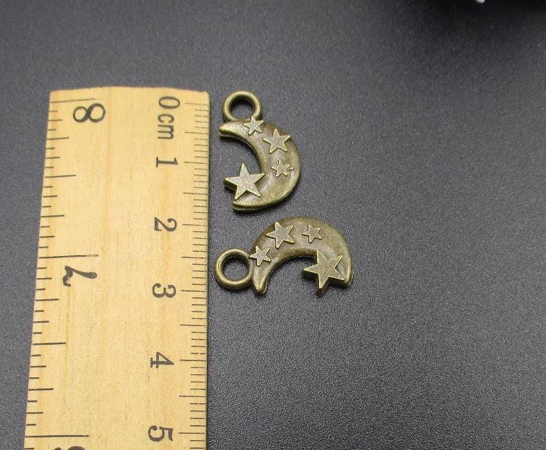 10Pcs 21\u00d713mm Bronze Stars and Moon Charms 2 Sided-p1893-A