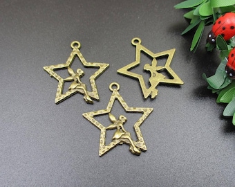 May include: Three gold-toned metal star charms with a fairy design. Each charm has a loop at the top for attaching to a necklace, bracelet, or other jewelry.