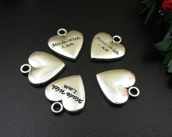 May include: Five silver heart-shaped charms with the words "Made with Love" inscribed on each charm.