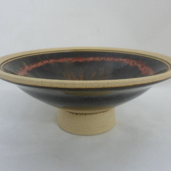 Studio pottery footed bowl with oil spot glaze in brown and red. Hand thrown hand decorated stoneware bowl by Roy Clarke of Cotswold pottery