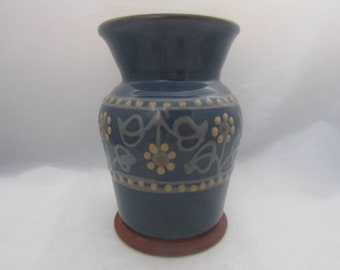 Studio pottery vase in blue with floral slip decoration by Anne Rodgers at Alsager Pottery