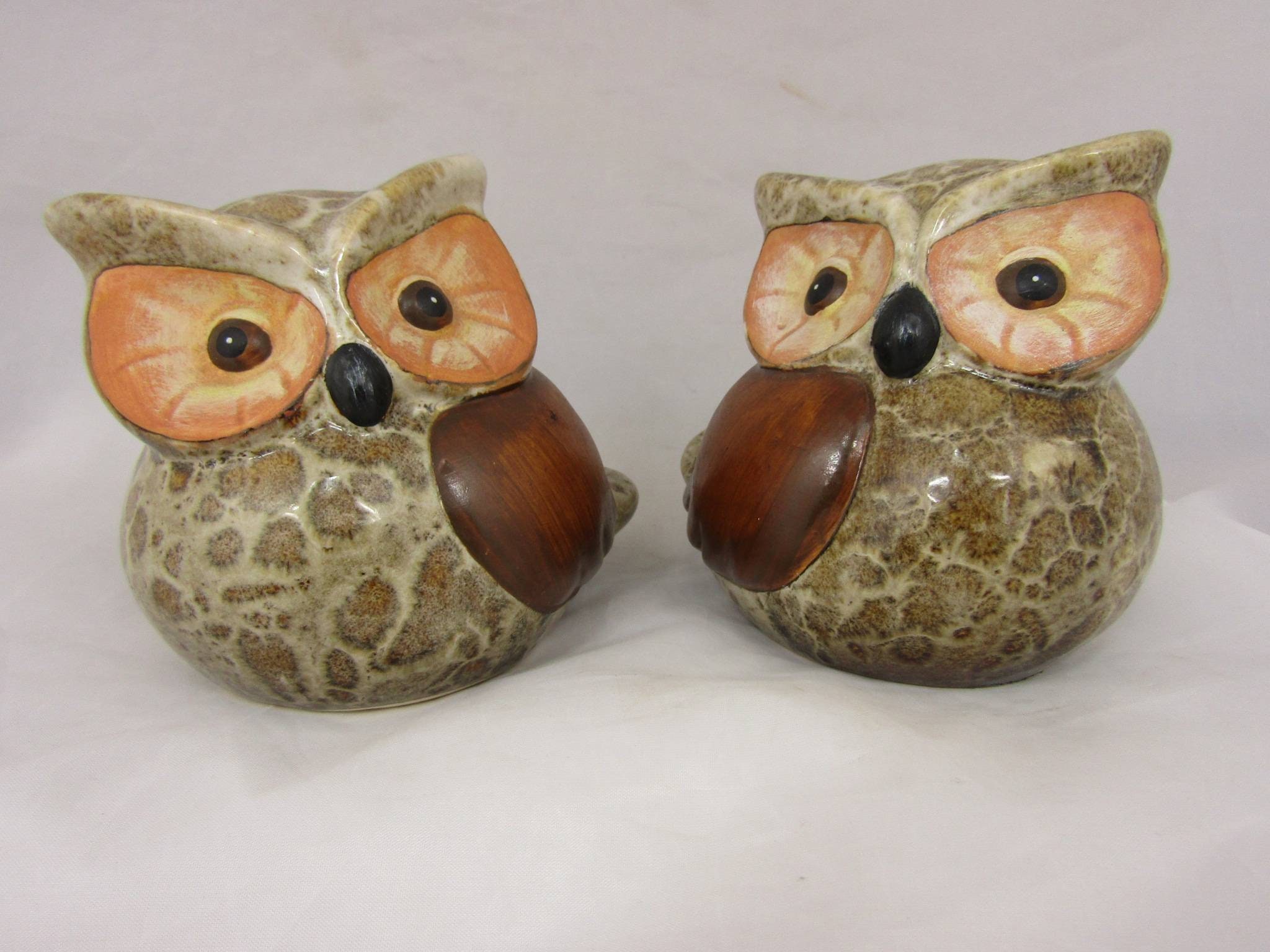 Pair of ceramic owls. Hand decorated owl figures